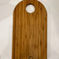 Tagliere a forma di arco in legno di bambù tinta caramello