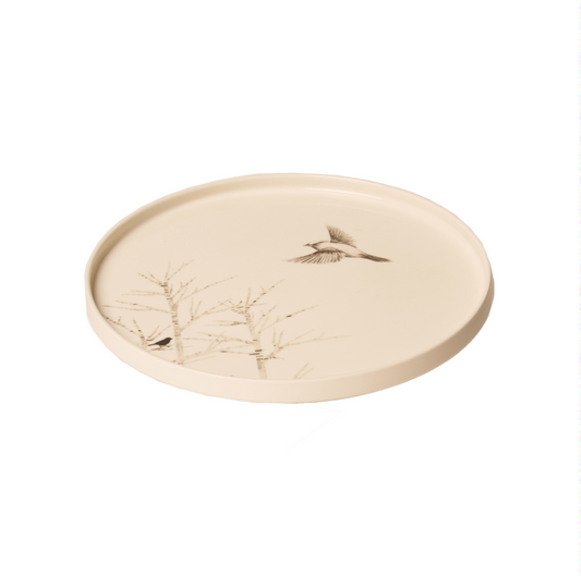 Piatto rotondo con alberi e uccellino