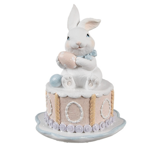 Statua decorativa con torta e coniglietto